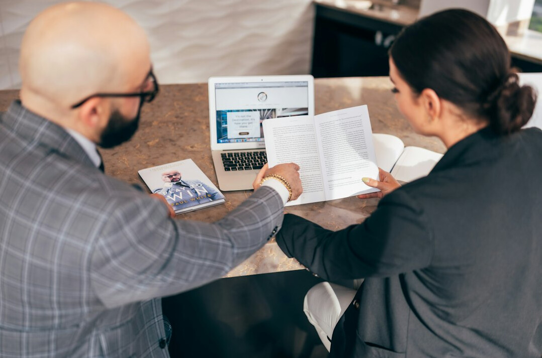 insurance agent discussing policy with client