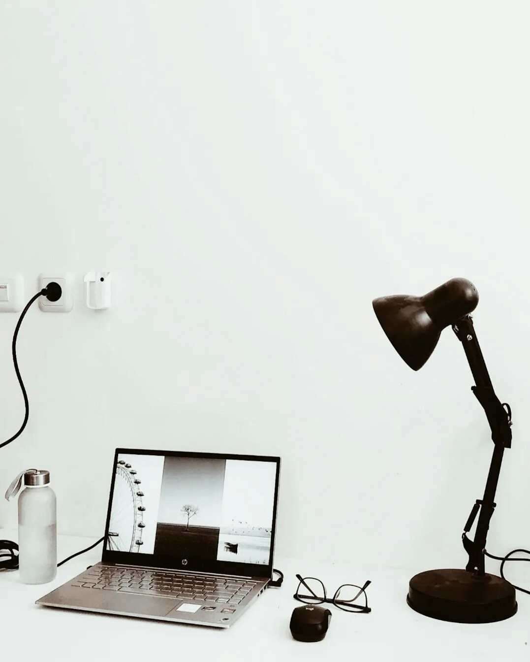 Desk with laptop displaying data charts and analytics dashboard