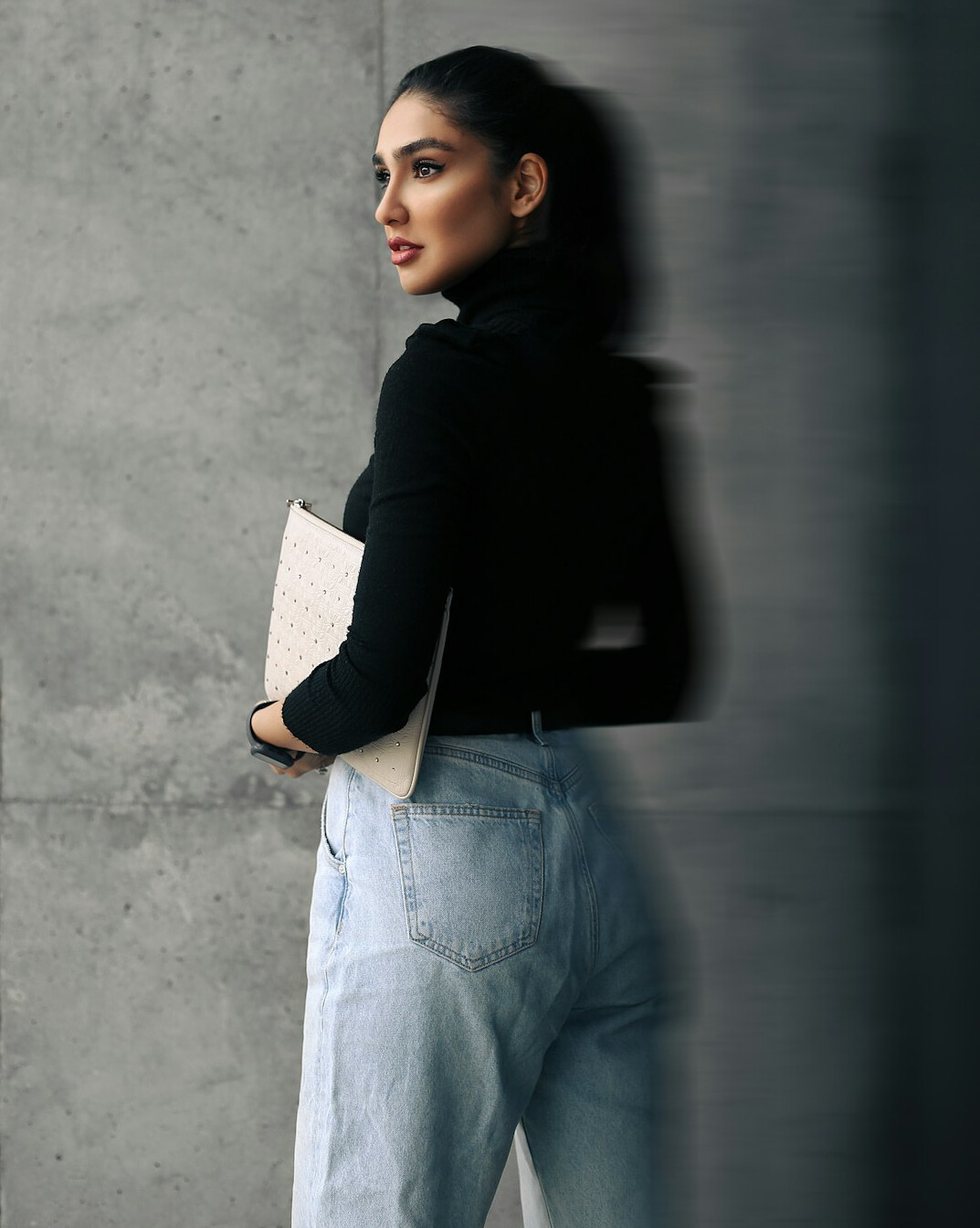 Malaysian Malay woman working focused at a laptop in an office